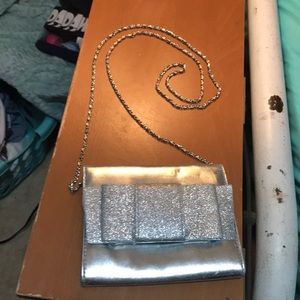 a reflective shiny silver purse